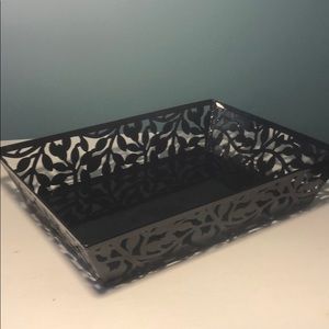 Black metal tray with flower cutout detail